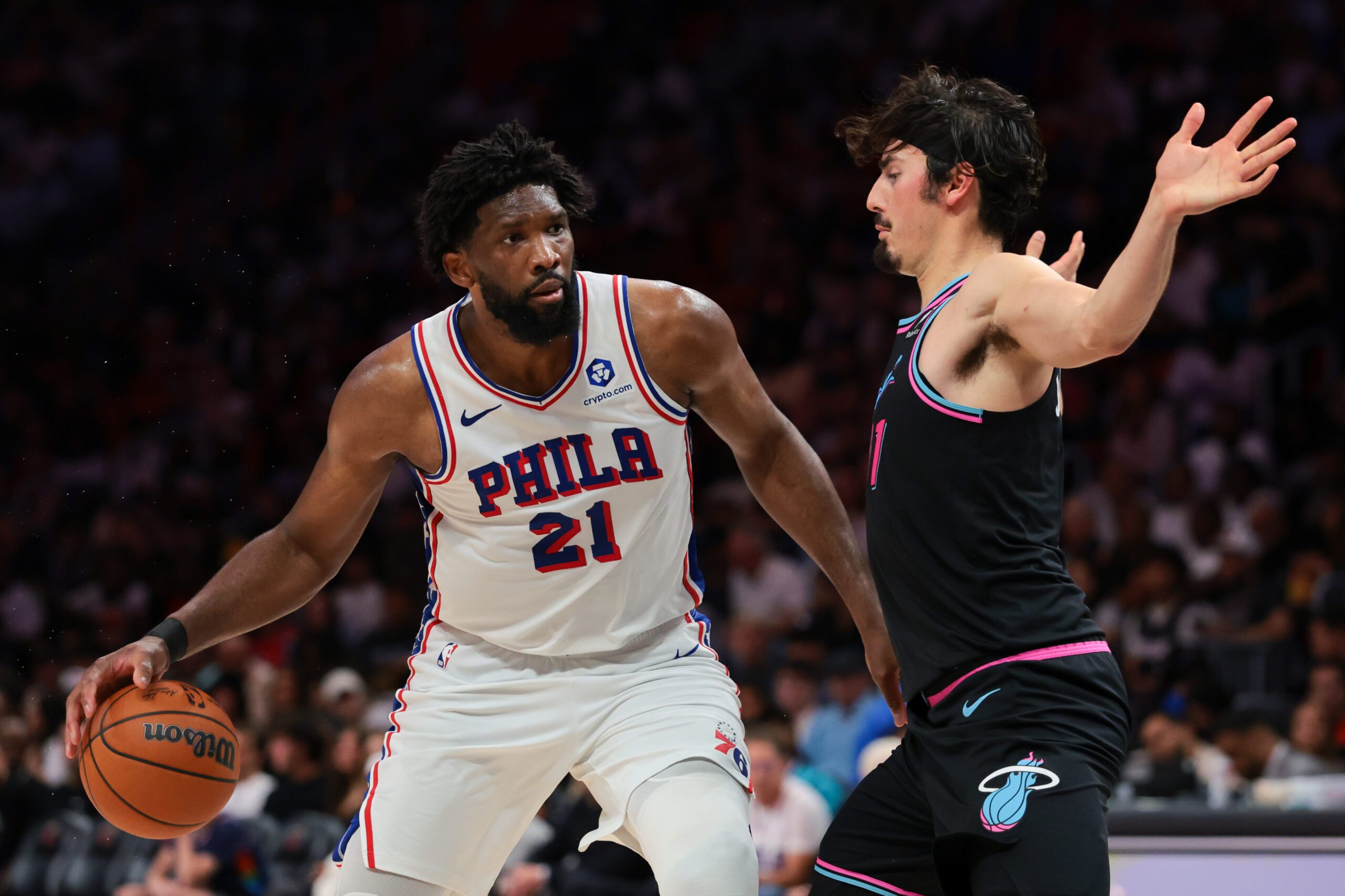 Mar 30, 2026; Miami, Florida, USA; Philadelphia 76ers center Joel Embiid (21) drives to the basket against Miami Heat forward Jaime Jaquez Jr. (11) during the third quarter at Kaseya Center. Mandatory Credit: Sam Navarro-Imagn Images