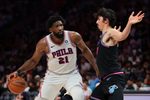 Mar 30, 2026; Miami, Florida, USA; Philadelphia 76ers center Joel Embiid (21) drives to the basket against Miami Heat forward Jaime Jaquez Jr. (11) during the third quarter at Kaseya Center. Mandatory Credit: Sam Navarro-Imagn Images