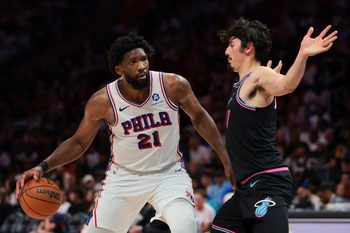 Mar 30, 2026; Miami, Florida, USA; Philadelphia 76ers center Joel Embiid (21) drives to the basket against Miami Heat forward Jaime Jaquez Jr. (11) during the third quarter at Kaseya Center. Mandatory Credit: Sam Navarro-Imagn Images