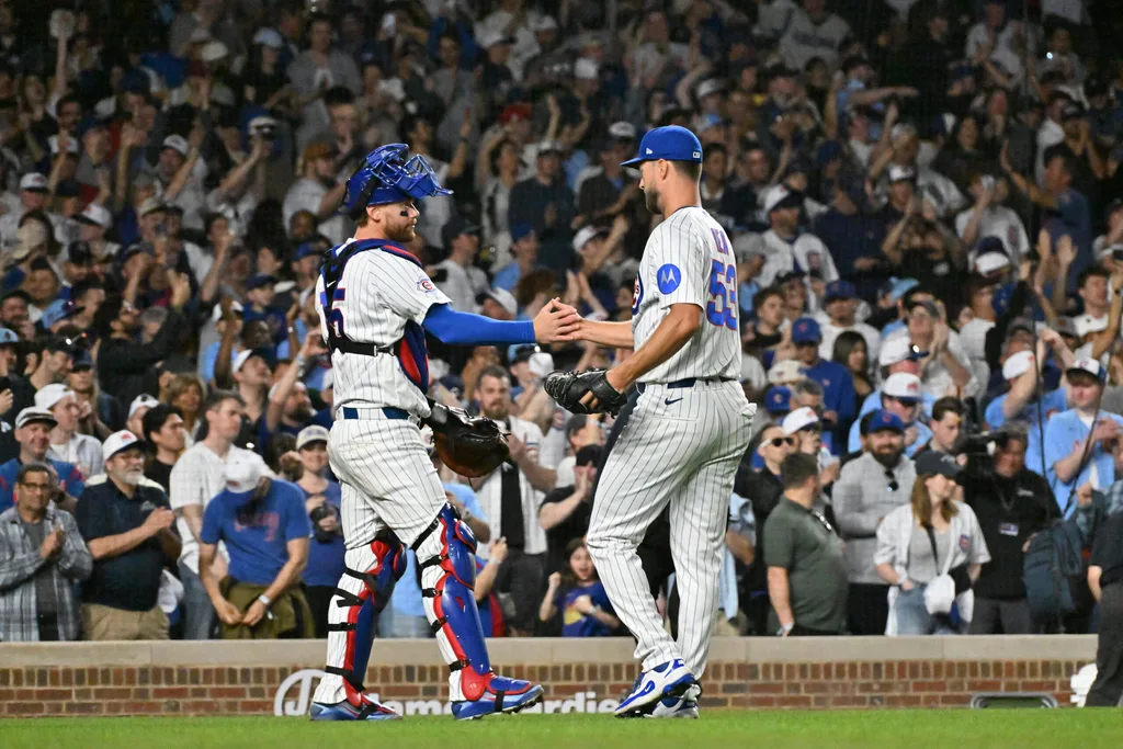 Mar 30, 2026; Chicago, Illinois, USA; Chicago Cubs catcher Carson Kelly (15) and pitcher Colin Rea (53) celebrate their victory over the Los Angeles Angels at Wrigley Field. Mandatory Credit: Patrick Gorski-Imagn Images
