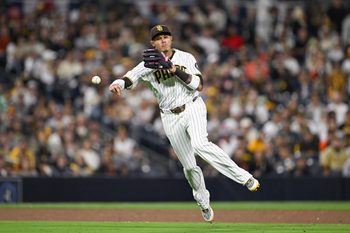 Mar 30, 2026; San Diego, California, USA; San Diego Padres third baseman Manny Machado (13) throws out San Francisco Giants third baseman Matt Chapman (26) during the sixth inning at Petco Park. Mandatory Credit: Denis Poroy-Imagn Images