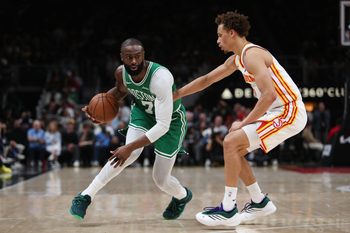 Mar 30, 2026; Atlanta, Georgia, USA; Boston Celtics guard Jaylen Brown (7) dribbles against Atlanta Hawks guard Dyson Daniels (5) in the first half at State Farm Arena. Mandatory Credit: Mady Mertens-Imagn Images