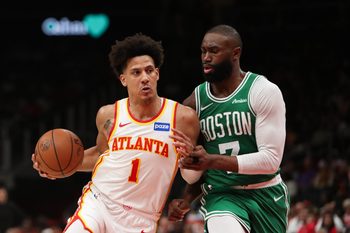 Mar 30, 2026; Atlanta, Georgia, USA; Atlanta Hawks forward Jalen Johnson (1) works past Boston Celtics guard Jaylen Brown (7) in the second half at State Farm Arena. Mandatory Credit: Mady Mertens-Imagn Images