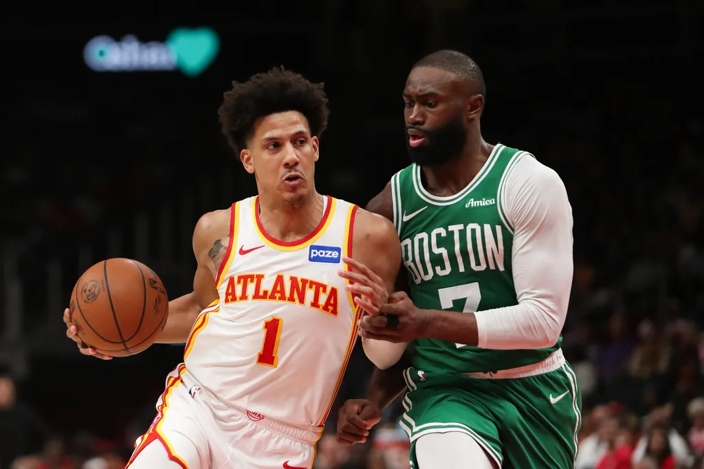 Mar 30, 2026; Atlanta, Georgia, USA; Atlanta Hawks forward Jalen Johnson (1) works past Boston Celtics guard Jaylen Brown (7) in the second half at State Farm Arena. Mandatory Credit: Mady Mertens-Imagn Images