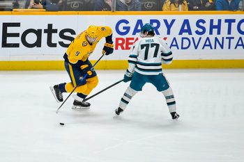 Mar 24, 2026; Nashville, Tennessee, USA;  Nashville Predators left wing Filip Forsberg (9) skates with the puck against the San Jose Sharks during the third period at Bridgestone Arena. Mandatory Credit: Steve Roberts-Imagn Images