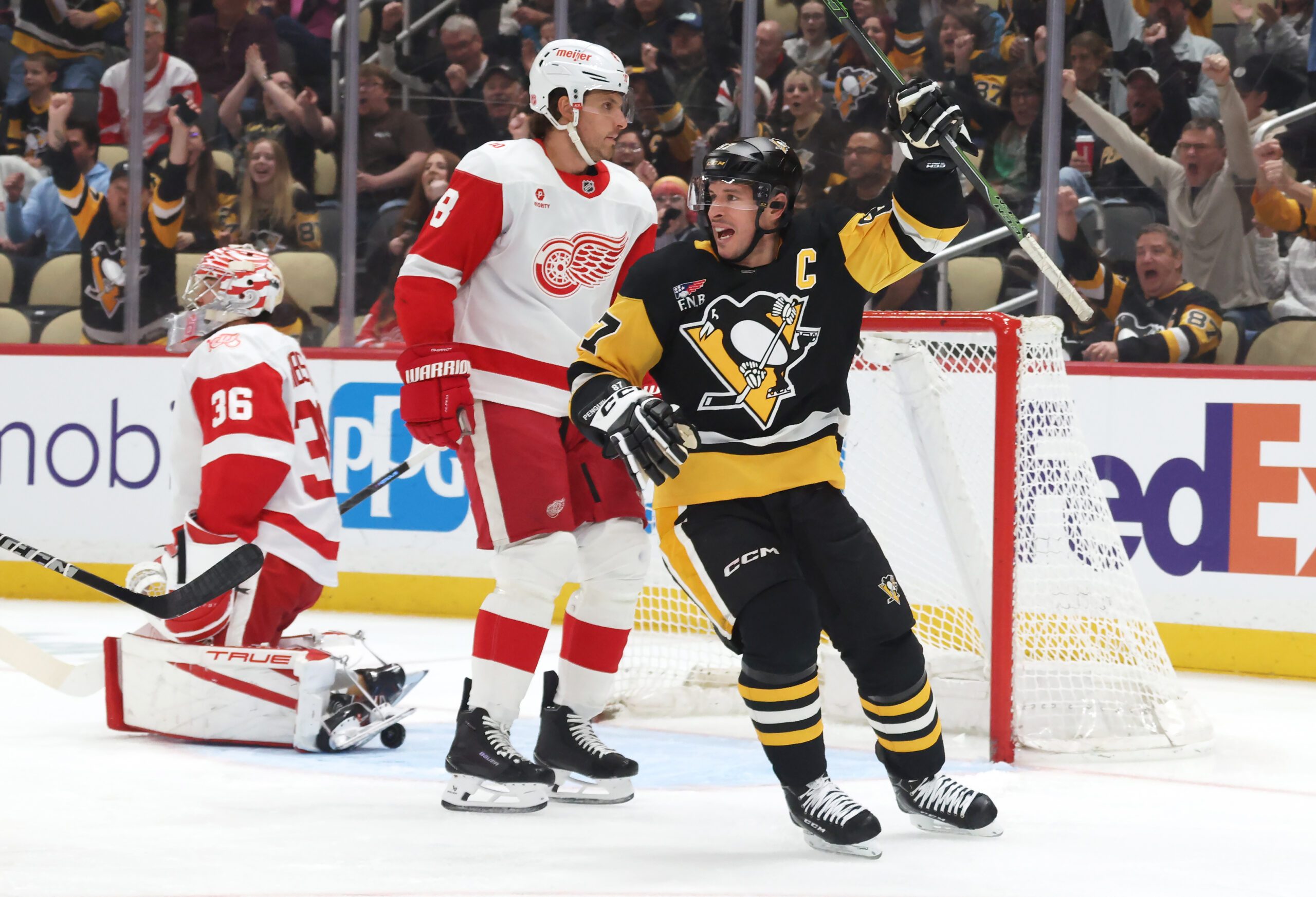 Mar 31, 2026; Pittsburgh, Pennsylvania, USA; Pittsburgh Penguins center Sidney Crosby (87) reacts to a goal by Pittsburgh right wing Rickard Rakell (not pictured) during the first period against the Detroit Red Wings at PPG Paints Arena. Mandatory Credit: Charles LeClaire-Imagn Images