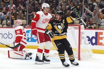 Mar 31, 2026; Pittsburgh, Pennsylvania, USA;  Pittsburgh Penguins center Sidney Crosby (87) reacts to a goal by Pittsburgh right wing Rickard Rakell (not pictured) during the first period against the Detroit Red Wings at PPG Paints Arena. Mandatory Credit: Charles LeClaire-Imagn Images