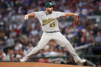 Mar 31, 2026; Atlanta, Georgia, USA; Athletics starting pitcher Aaron Civale (45) throws against the Atlanta Braves in the third inning at Truist Park. Mandatory Credit: Brett Davis-Imagn Images