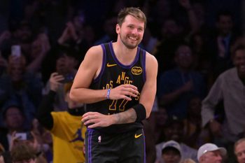 Mar 31, 2026; Los Angeles, California, USA;  Los Angeles Lakers guard Luka Doncic (77) smiles after a dunk in the final minutes of the game against the Cleveland Cavaliers at Crypto.com Arena. Mandatory Credit: Jayne Kamin-Oncea-Imagn Images