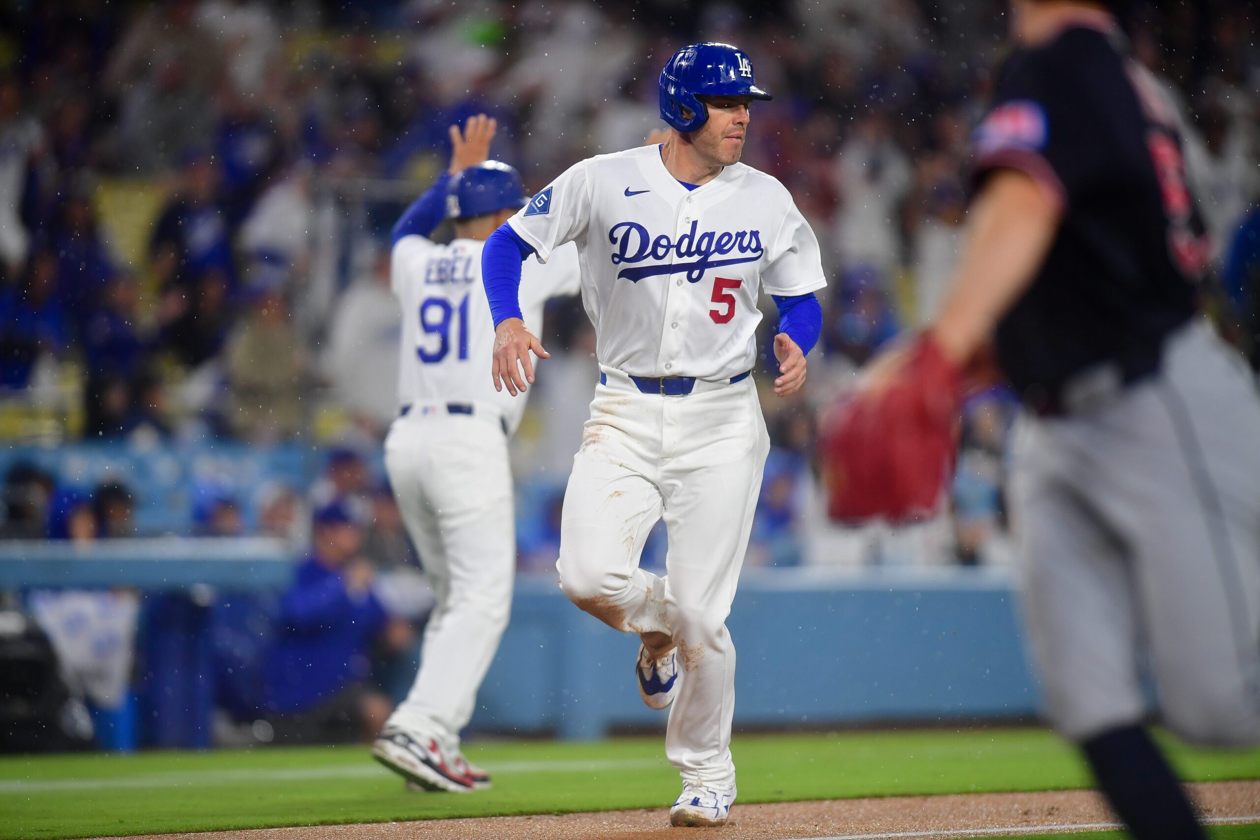 Mar 31, 2026; Los Angeles, California, USA; Los Angeles Dodgers first baseman Freddie Freeman (5) runs home to score against the Cleveland Guardians during the eighth inning at Dodger Stadium. Mandatory Credit: Gary A. Vasquez-Imagn Images