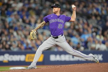 Apr 1, 2026; Toronto, Ontario, CAN; Colorado Rockies starting pitcher Kyle Freeland (21) pitches to the Toronto Blue Jays during the second inning at Rogers Centre. Mandatory Credit: John E. Sokolowski-Imagn Images