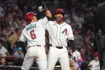 Arizona Diamondbacks' Ildemaro Vargas (6) celebrates his solo home run with teammate Jordan Lawlar (10) during their game against the Detroit Tigers at Chase Field on March 30, 2026.