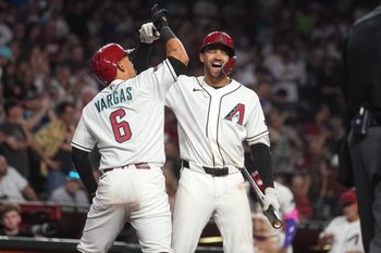 Arizona Diamondbacks' Ildemaro Vargas (6) celebrates his solo home run with teammate Jordan Lawlar (10) during their game against the Detroit Tigers at Chase Field on March 30, 2026.