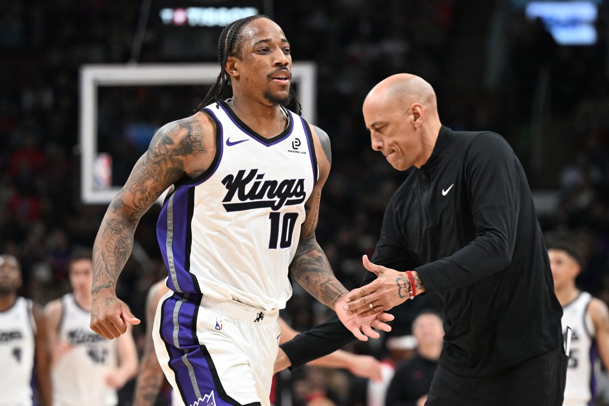 Apr 1, 2026; Toronto, Ontario, CAN; Sacramento Kings forward DeMar DeRozan (10) slaps hands with head coach Doug Christie after making a three-point basket against the Toronto Raptors in the second half at Scotiabank Arena. Mandatory Credit: Dan Hamilton-Imagn Images