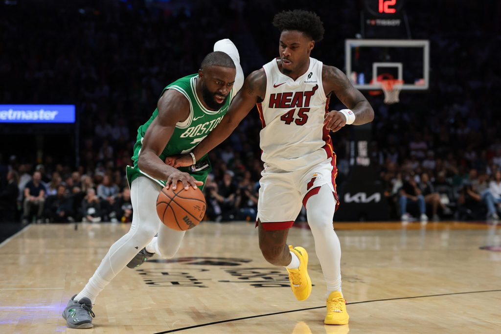 Apr 1, 2026; Miami, Florida, USA; Boston Celtics guard Jaylen Brown (7) drives to the basket against Miami Heat guard Davion Mitchell (45) during the fourth quarter at Kaseya Center. Mandatory Credit: Sam Navarro-Imagn Images