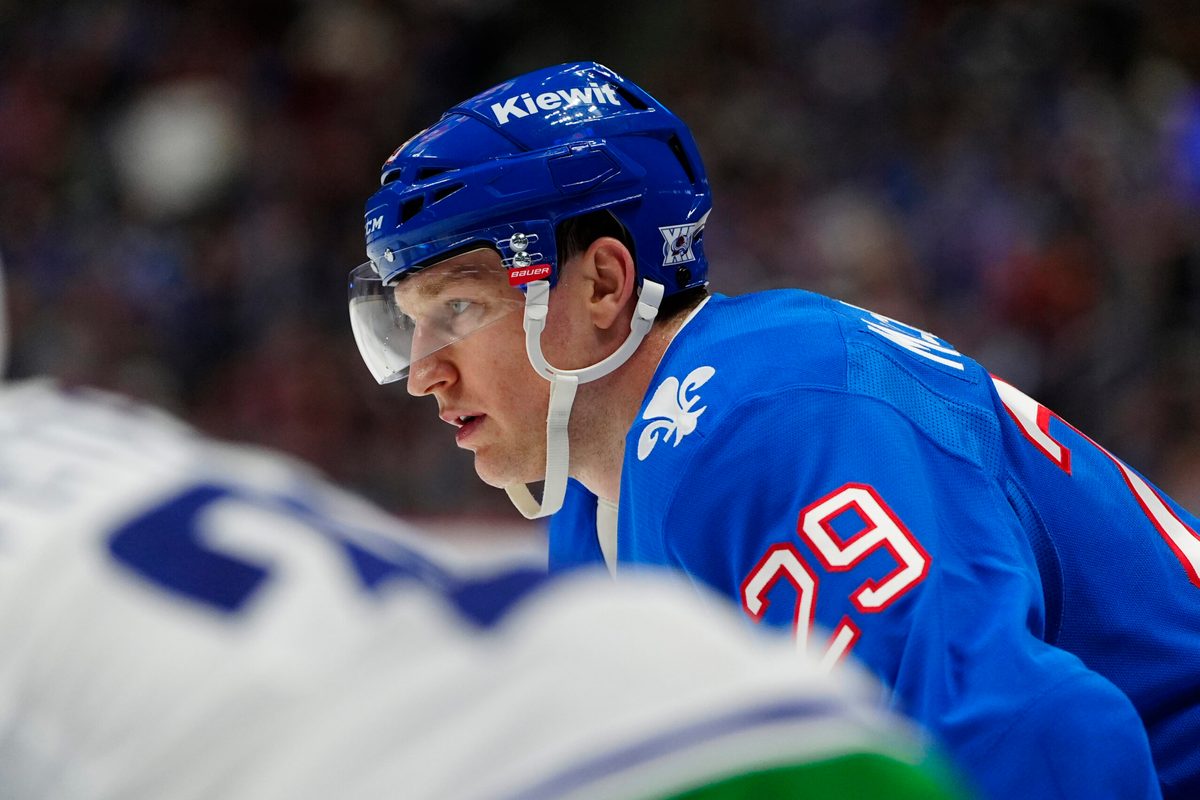 Apr 1, 2026; Denver, Colorado, USA; Colorado Avalanche center Nathan MacKinnon (29) during the second period against the Vancouver Canucks at Ball Arena. Mandatory Credit: Ron Chenoy-Imagn Images