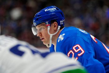 Apr 1, 2026; Denver, Colorado, USA; Colorado Avalanche center Nathan MacKinnon (29) during the second period against the Vancouver Canucks at Ball Arena. Mandatory Credit: Ron Chenoy-Imagn Images