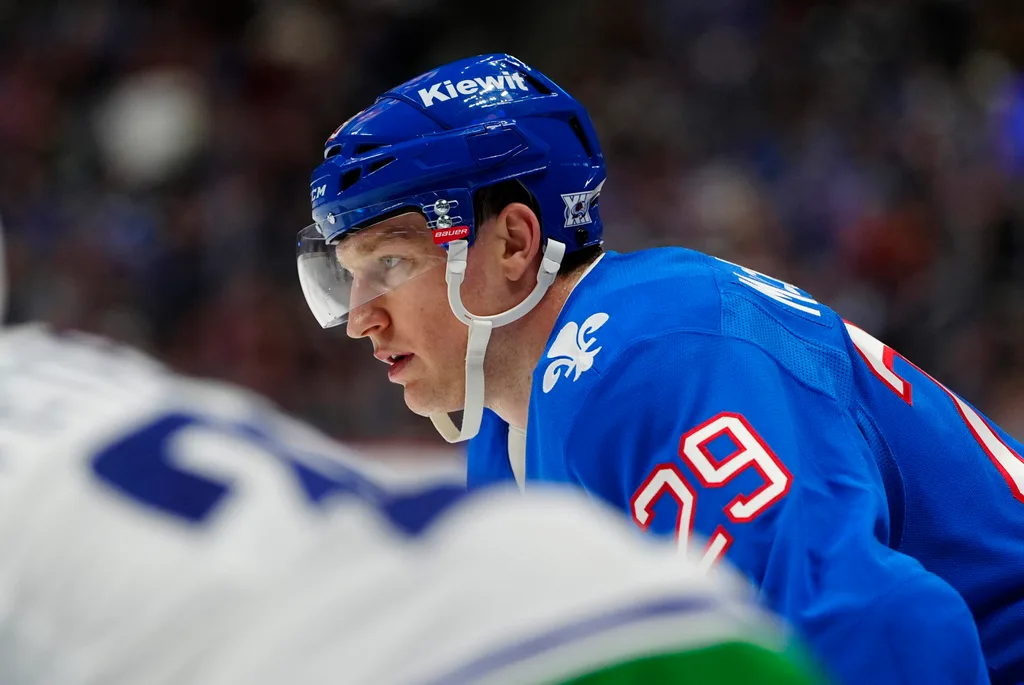 Apr 1, 2026; Denver, Colorado, USA; Colorado Avalanche center Nathan MacKinnon (29) during the second period against the Vancouver Canucks at Ball Arena. Mandatory Credit: Ron Chenoy-Imagn Images