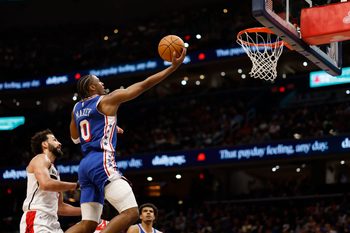 Apr 1, 2026; Washington, District of Columbia, USA; Philadelphia 76ers guard Tyrese Maxey (0) shoots the ball as Washington Wizards forward Anthony Gill (16) defends in the first half at Capital One Arena. Mandatory Credit: Geoff Burke-Imagn Images