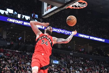 Apr 1, 2026; Toronto, Ontario, CAN;   Toronto Raptors center Sandro Mamukelashvili (54) dunks for a basket against the Sacramento Kings in the second half at Scotiabank Arena. Mandatory Credit: Dan Hamilton-Imagn Images