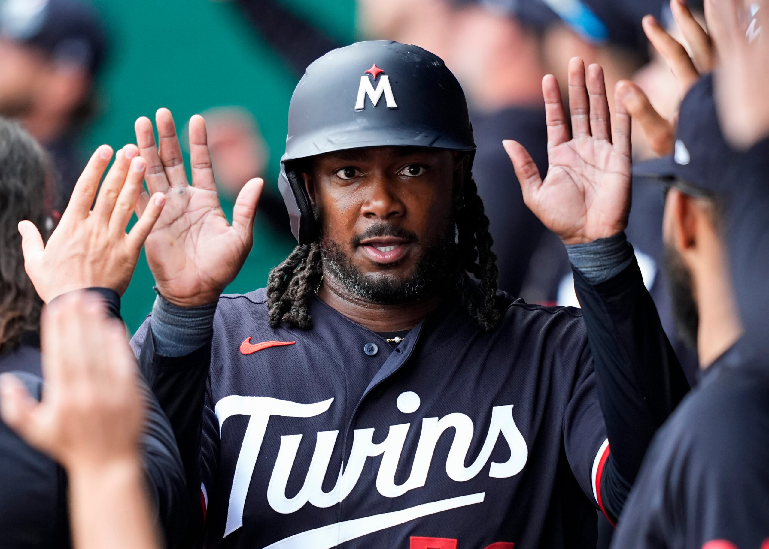 Apr 2, 2026; Kansas City, Missouri, USA; Minnesota Twins first baseman Josh Bell (56) is congratulated by teammates after scoring a run during the eighth inning against the Kansas City Royals at Kauffman Stadium. Mandatory Credit: Jay Biggerstaff-Imagn Images