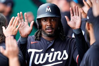 Apr 2, 2026; Kansas City, Missouri, USA; Minnesota Twins first baseman Josh Bell (56) is congratulated by teammates after scoring a run during the eighth inning against the Kansas City Royals at Kauffman Stadium. Mandatory Credit: Jay Biggerstaff-Imagn Images