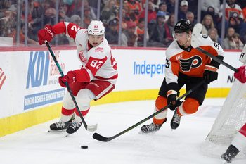 Apr 2, 2026; Philadelphia, Pennsylvania, USA; Detroit Red Wings center Marco Kasper (92) battles for the puck against Philadelphia Flyers defenseman Rasmus Ristolainen (55) in the first period at Xfinity Mobile Arena. Mandatory Credit: Kyle Ross-Imagn Images