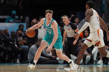Apr 2, 2026; Charlotte, North Carolina, USA; Charlotte Hornets guard/forward Kon Knueppel (7) dribbles while guarded by Phoenix Suns guard Jalen Green (4) during the second half at Spectrum Center. Mandatory Credit: Jim Dedmon-Imagn Images