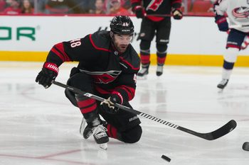 Apr 2, 2026; Raleigh, North Carolina, USA;  Carolina Hurricanes left wing Jordan Martinook (48) watches his blocked shot against the Columbus Blue Jackets during the third period at Lenovo Center. Mandatory Credit: James Guillory-Imagn Images