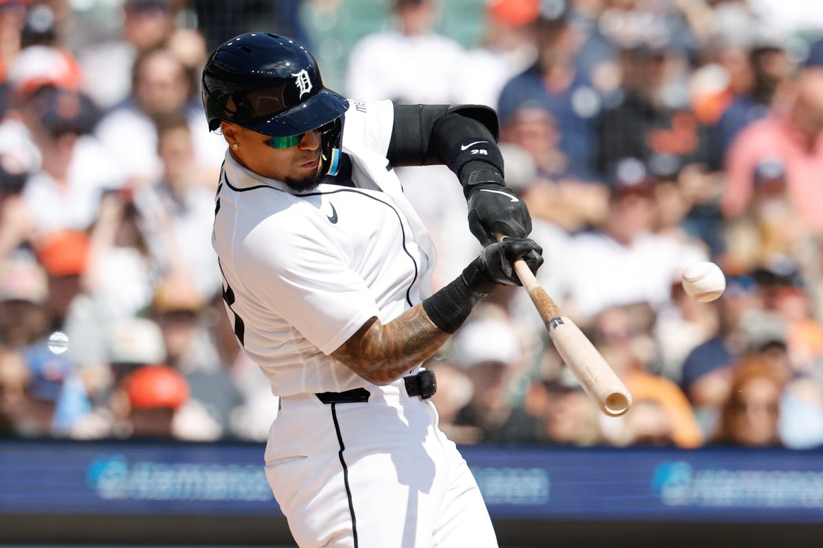 Apr 3, 2026; Detroit, Michigan, USA; Detroit Tigers center fielder Javier Baez (28) hits a single in the third inning against the St. Louis Cardinals at Comerica Park. Mandatory Credit: Rick Osentoski-Imagn Images