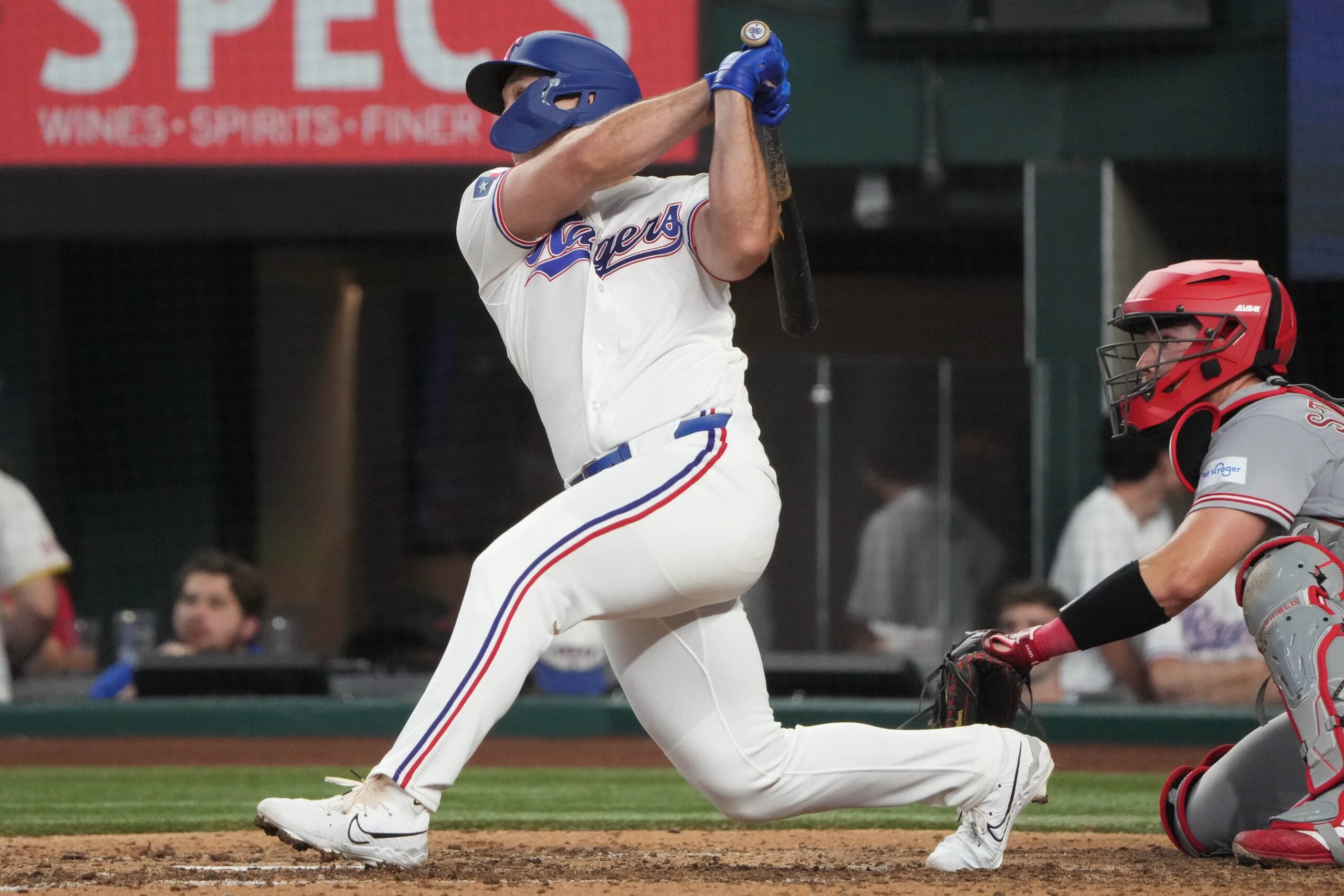 Apr 3, 2026; Arlington, Texas, USA; Texas Rangers left fielder Wyatt Langford (36) follows through on his RBI double against the Cincinnati Reds during the seventh inning at Globe Life Field. Mandatory Credit: Jim Cowsert-Imagn Images