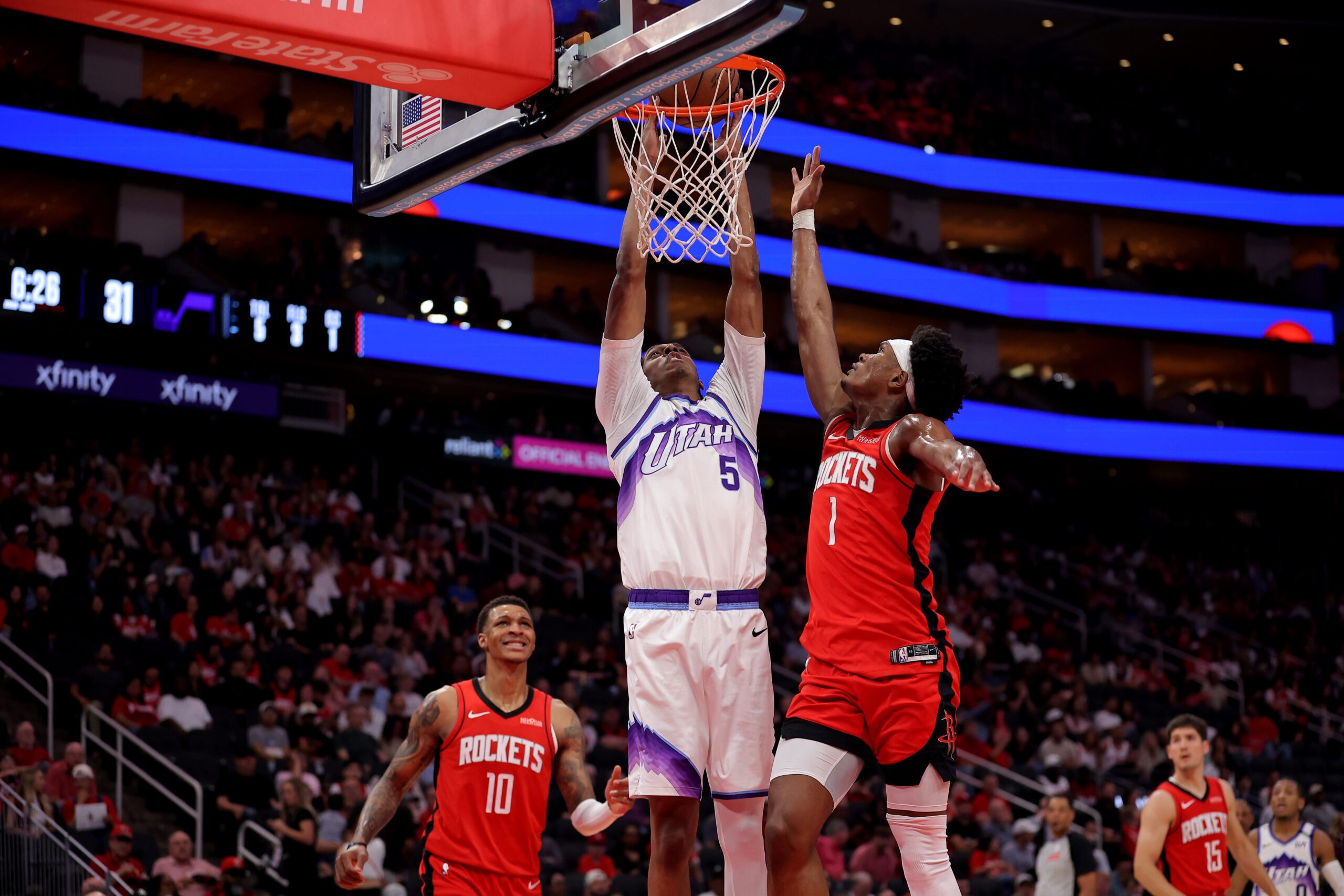 Apr 3, 2026; Houston, Texas, USA; Utah Jazz forward Cody Williams (5) shoots inside inside against Houston Rockets guard Amen Thompson (1) during the second quarter at Toyota Center. Mandatory Credit: Erik Williams-Imagn Images