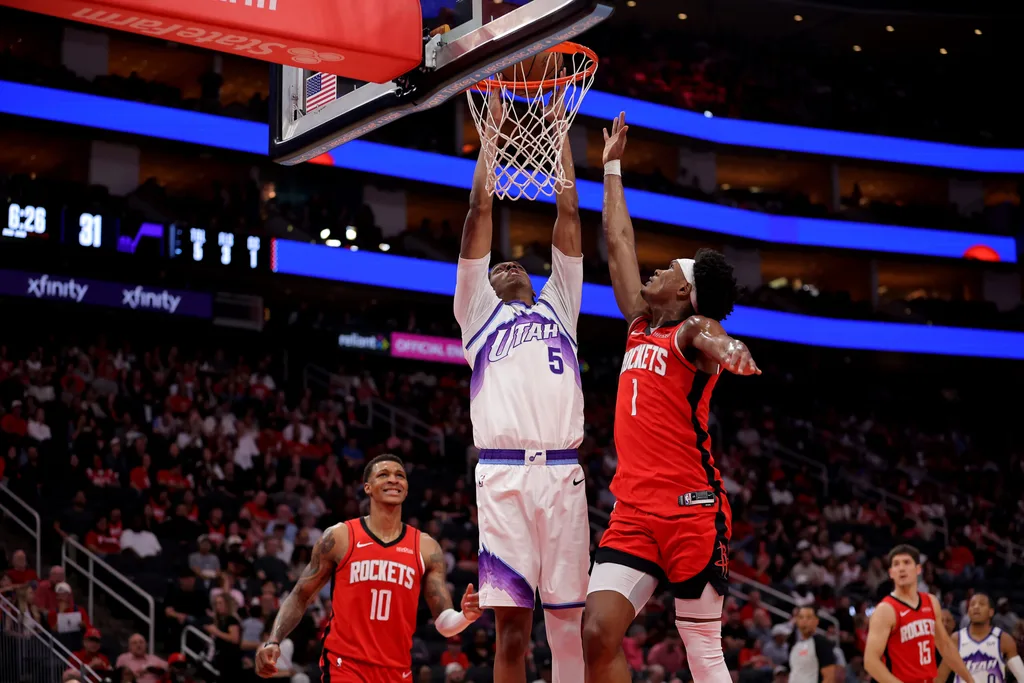 Apr 3, 2026; Houston, Texas, USA; Utah Jazz forward Cody Williams (5) shoots inside inside against Houston Rockets guard Amen Thompson (1) during the second quarter at Toyota Center. Mandatory Credit: Erik Williams-Imagn Images