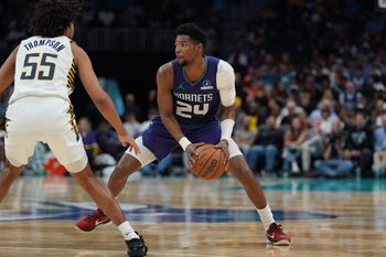 Apr 3, 2026; Charlotte, North Carolina, USA; Charlotte Hornets forward Brandon Miller (24) handles the ball defended by Indiana Pacers guard Ethan Thompson (55) during the second half at Spectrum Center. Mandatory Credit: Jim Dedmon-Imagn Images