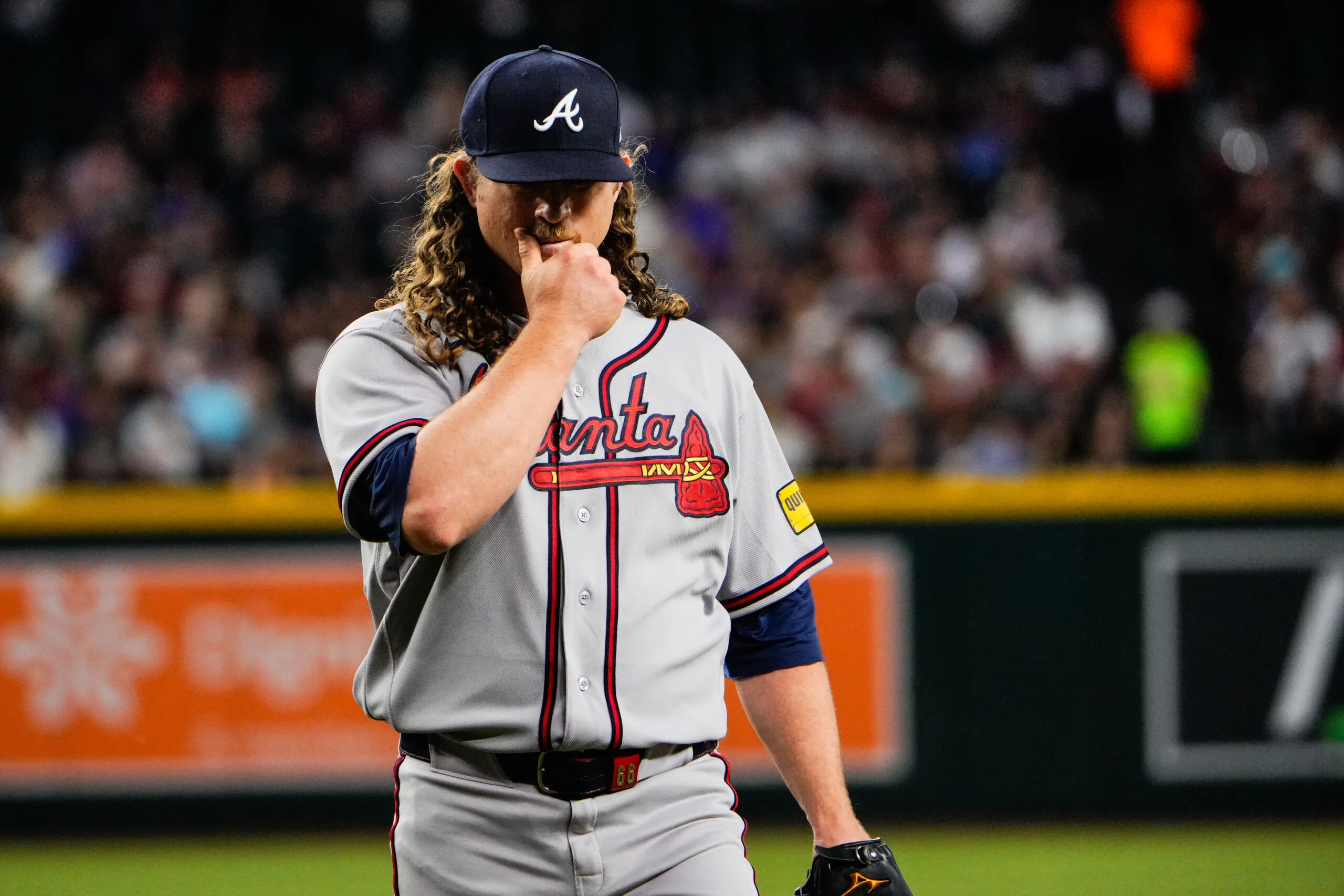 Apr 3, 2026; Phoenix, Arizona, USA; Atlanta Braves pitcher Grant Holmes (66) walks to the dugout during the first inning of the game against the Atlanta Braves at Chase Field. Mandatory Credit: Arianna Grainey-Imagn Images
