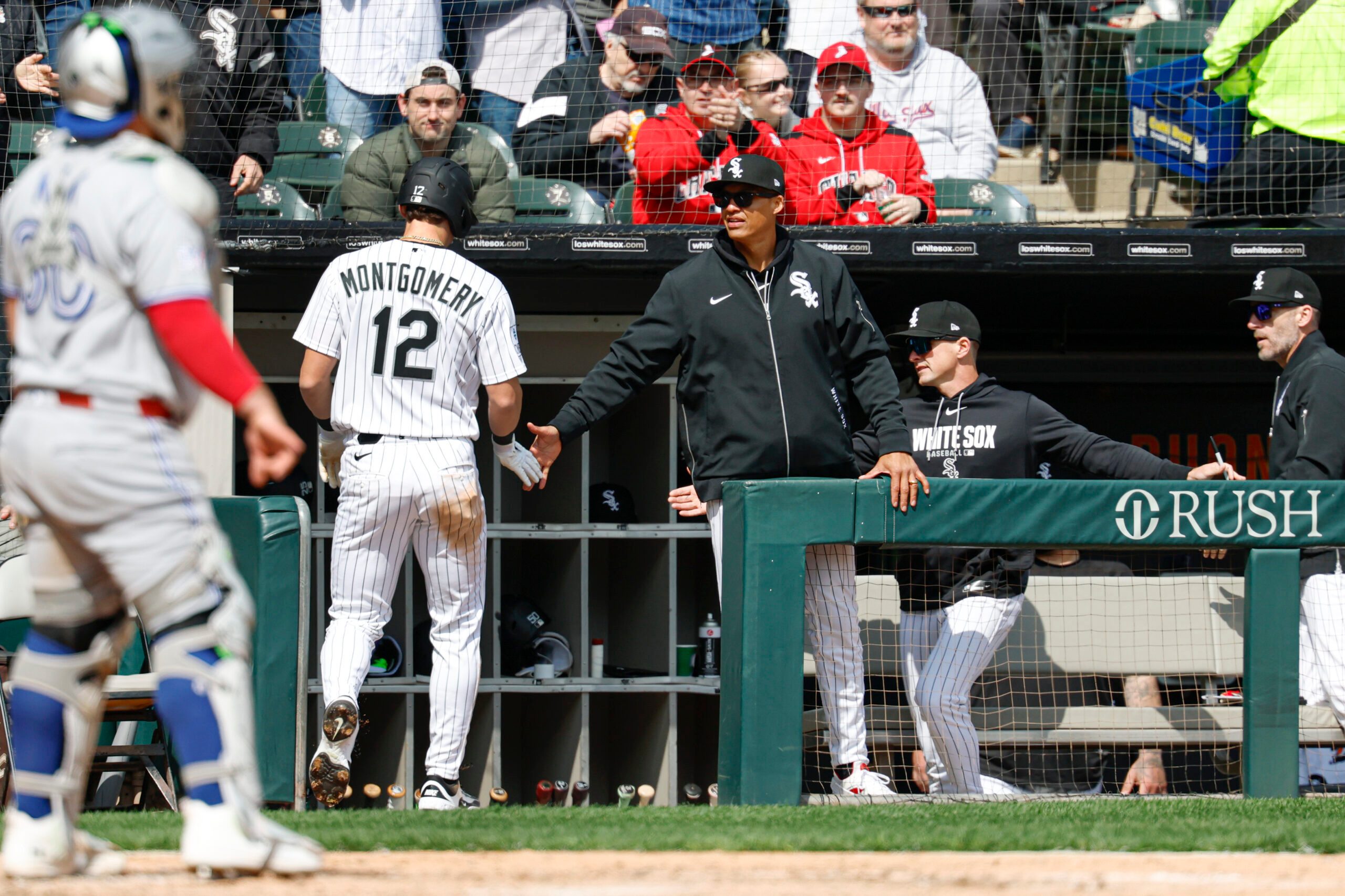 Apr 3, 2026; Chicago, Illinois, USA; Chicago White Sox manager Will Venable congratulates shortstop Colson Montgomery (12) after he scored against the Toronto Blue Jays during the third inning at Rate Field. Mandatory Credit: Kamil Krzaczynski-Imagn Images