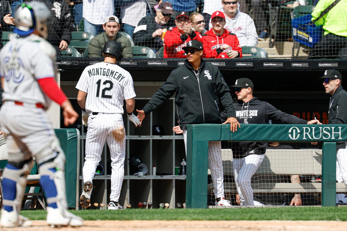 Apr 3, 2026; Chicago, Illinois, USA; Chicago White Sox manager Will Venable congratulates shortstop Colson Montgomery (12) after he scored against the Toronto Blue Jays during the third inning at Rate Field. Mandatory Credit: Kamil Krzaczynski-Imagn Images