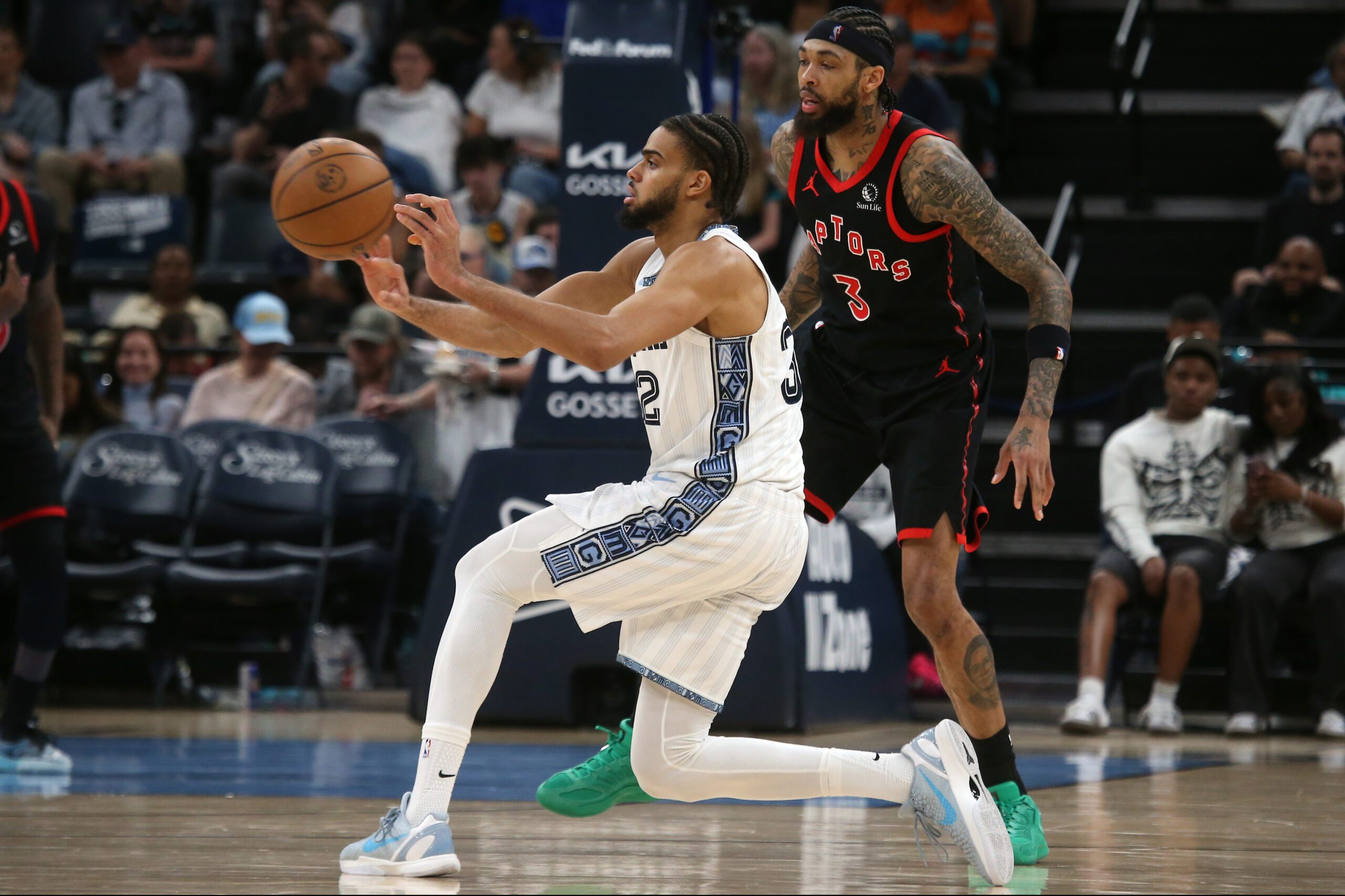 Apr 3, 2026; Memphis, Tennessee, USA; Memphis Grizzlies guard Rayan Rupert (32) passes the ball during the third quarter against the Toronto Raptors at FedExForum. Mandatory Credit: Petre Thomas-Imagn Images