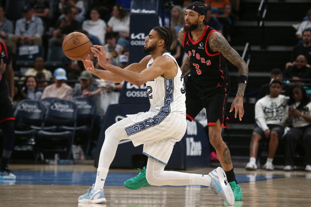 Apr 3, 2026; Memphis, Tennessee, USA; Memphis Grizzlies guard Rayan Rupert (32) passes the ball during the third quarter against the Toronto Raptors at FedExForum. Mandatory Credit: Petre Thomas-Imagn Images