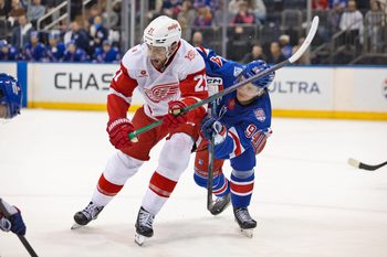 Apr 4, 2026; New York, New York, USA; Detroit Red Wings left wing James van Riemsdyk (21) tries to get past New York Rangers right wing Gabe Perreault (94) during the third period at Madison Square Garden. Mandatory Credit: Danny Wild-Imagn Images