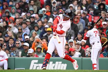 Apr 4, 2026; Foxborough, Massachusetts, USA; Boston Red Sox second baseman Marcelo Mayer (11) hits a sacrifice flyball during the second inning against the San Diego Padres at Fenway Park. Mandatory Credit: Eric Canha-Imagn Images