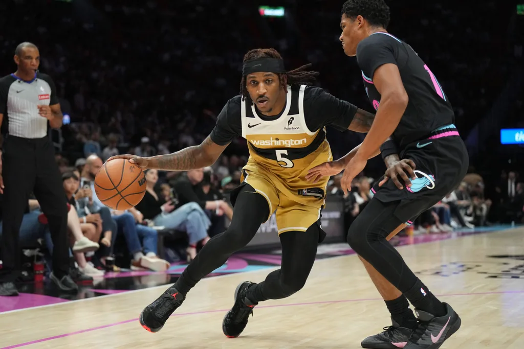 Apr 4, 2026; Miami, Florida, USA; Washington Wizards guard Jamir Watkins (5) drives past Miami Heat guard Dru Smith (12) during the second half at Kaseya Center. Mandatory Credit: Jim Rassol-Imagn Images
