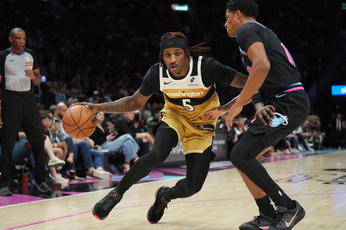 Apr 4, 2026; Miami, Florida, USA; Washington Wizards guard Jamir Watkins (5) drives past Miami Heat guard Dru Smith (12) during the second half at Kaseya Center. Mandatory Credit: Jim Rassol-Imagn Images