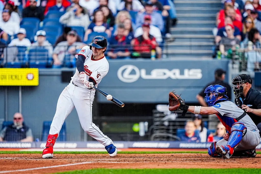 Guardians right fielder Chase DeLauter makes contact during the home opener against the Chicago Cubs, April 4, 2026, in Cleveland.