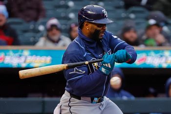 Apr 4, 2026; Minneapolis, Minnesota, USA; Tampa Bay Rays first baseman Yandy Diaz (2) gets hit by a pitch for an RBI against the Minnesota Twins in the second inning at Target Field. Mandatory Credit: Bruce Kluckhohn-Imagn Images