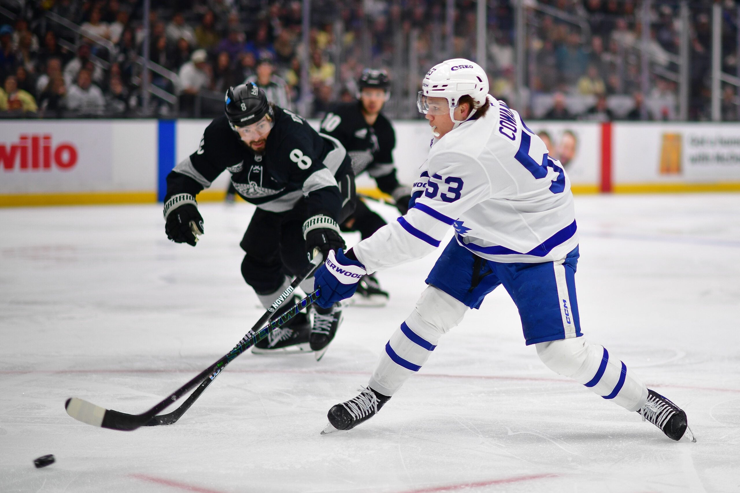 Apr 4, 2026; Los Angeles, California, USA; Toronto Maple Leafs right wing Easton Cowan (53) moves in for a shot on goal against Los Angeles Kings defenseman Drew Doughty (8) during the third period at Crypto.com Arena. Mandatory Credit: Gary A. Vasquez-Imagn Images