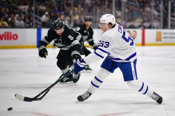 Apr 4, 2026; Los Angeles, California, USA; Toronto Maple Leafs right wing Easton Cowan (53) moves in for a shot on goal against Los Angeles Kings defenseman Drew Doughty (8) during the third period at Crypto.com Arena. Mandatory Credit: Gary A. Vasquez-Imagn Images
