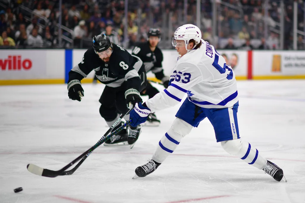 Apr 4, 2026; Los Angeles, California, USA; Toronto Maple Leafs right wing Easton Cowan (53) moves in for a shot on goal against Los Angeles Kings defenseman Drew Doughty (8) during the third period at Crypto.com Arena. Mandatory Credit: Gary A. Vasquez-Imagn Images
