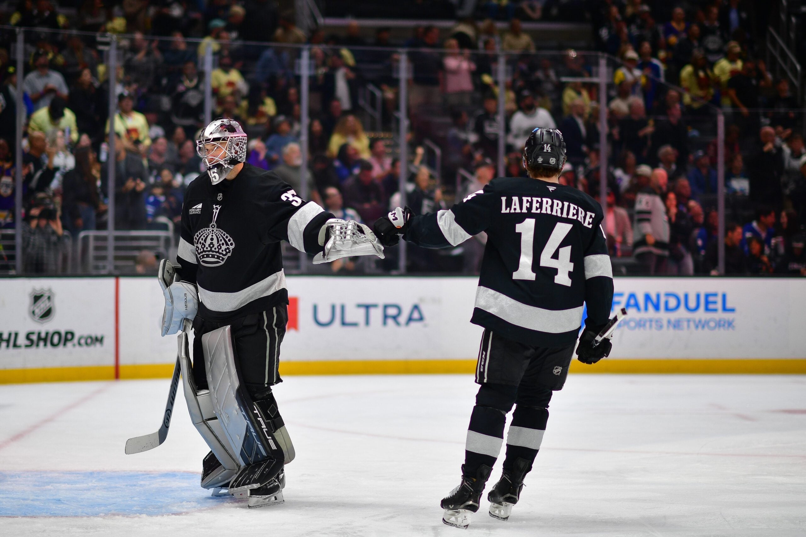 Apr 4, 2026; Los Angeles, California, USA; Los Angeles Kings right wing Alex Laferriere (14) celebrates his goal scored against the Toronto Maple Leafs with goaltender Darcy Kuemper (35) during the third period at Crypto.com Arena. Mandatory Credit: Gary A. Vasquez-Imagn Images