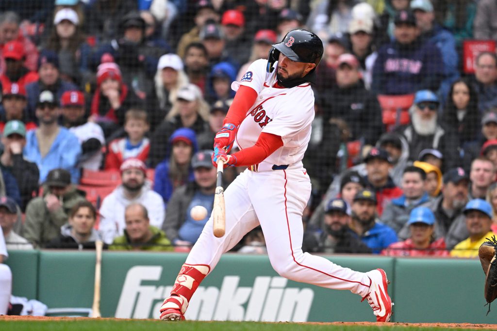 Apr 5, 2026; Boston, Massachusetts, USA; Boston Red Sox right fielder Wilyer Abreu (52) hits a single against the San Diego Padres during the second inning at Fenway Park. Mandatory Credit: Eric Canha-Imagn Images